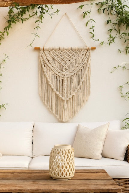 Boho-style macramé wall hanging with natural cotton and wooden rod